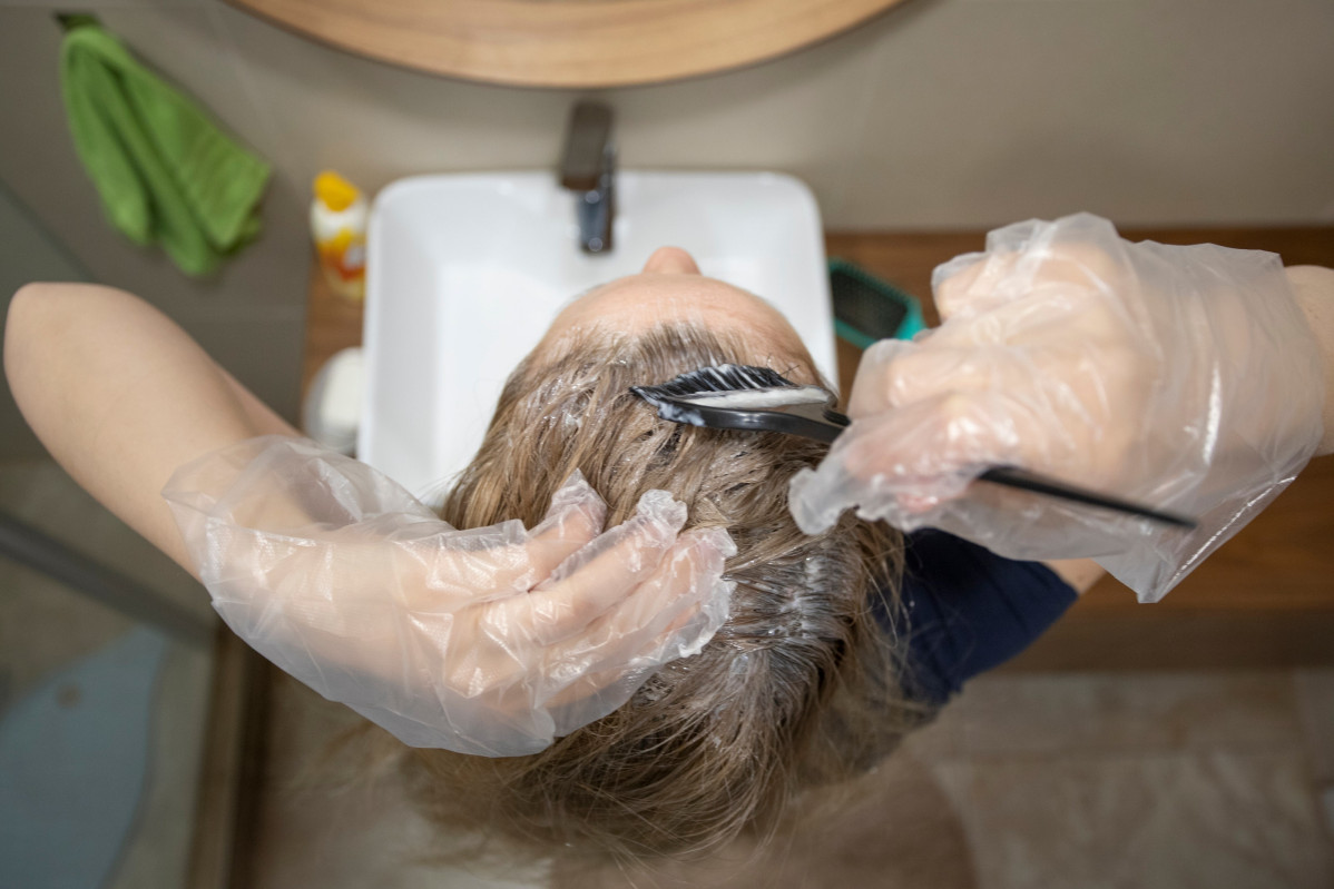 Woman dyeing own hair